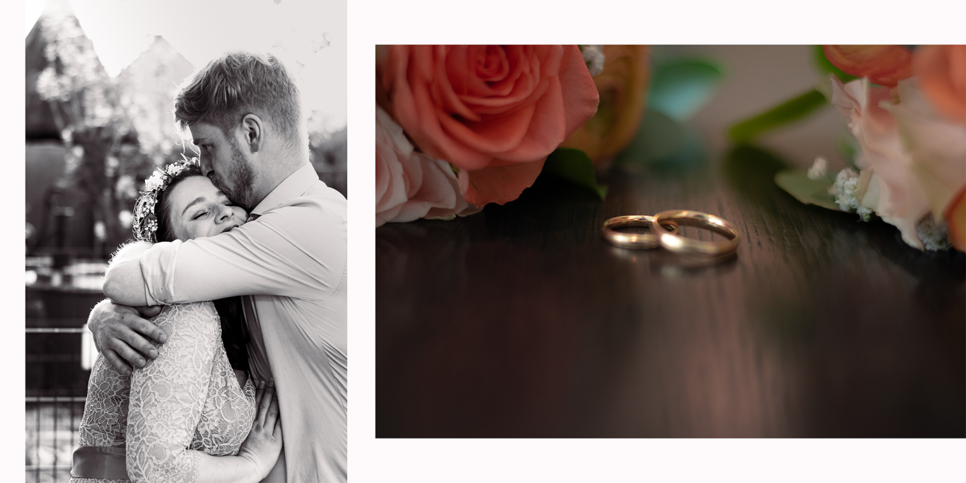 Hochzeitsreportage Kerpen Trauringe Ein Paar umarmt sich, daneben zwei goldene Ringe auf einem dunklen Untergrund.